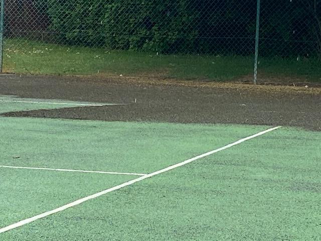 Recolouring and court refurbishment work on a hard court.