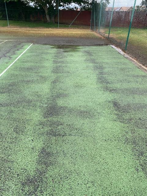 Full court refurbishment with line marking and finished tennis court surface.